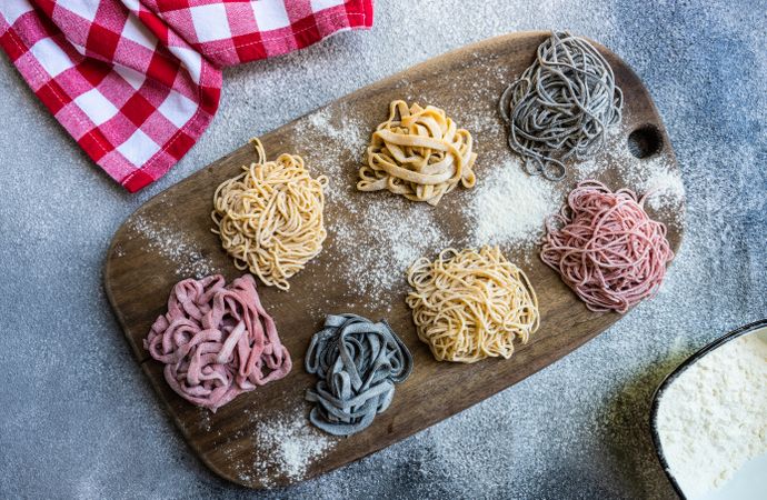 Cooking concept with homemade pasta on cutting board