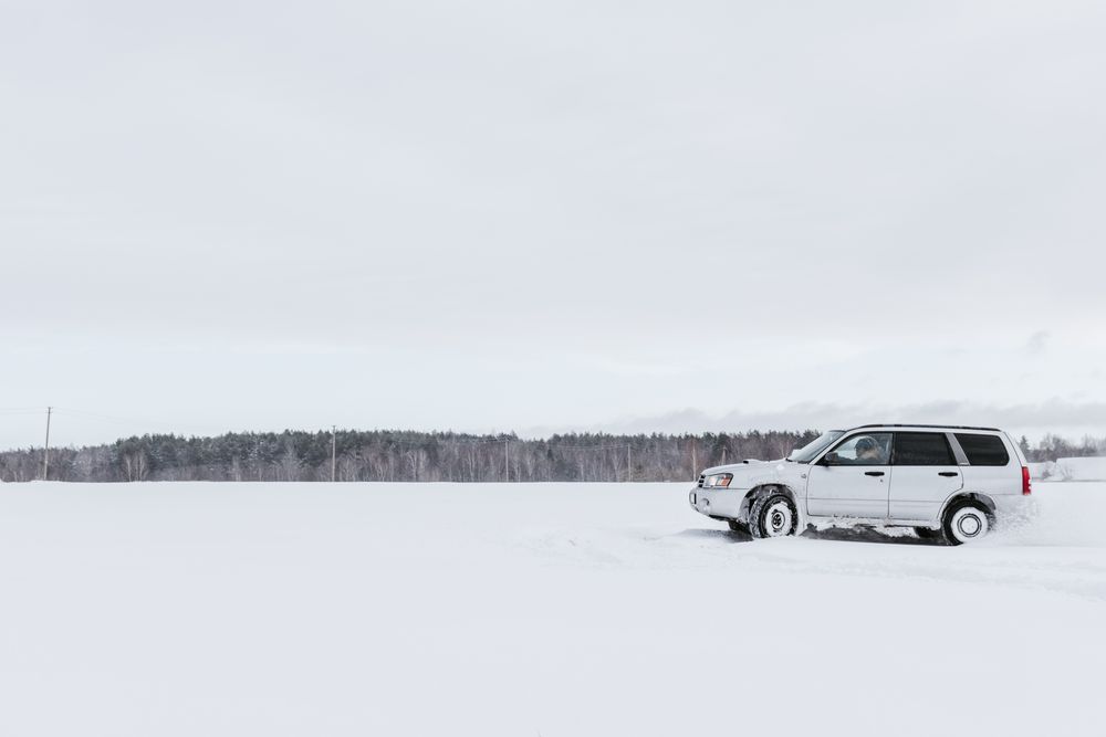 Car driving on snow field