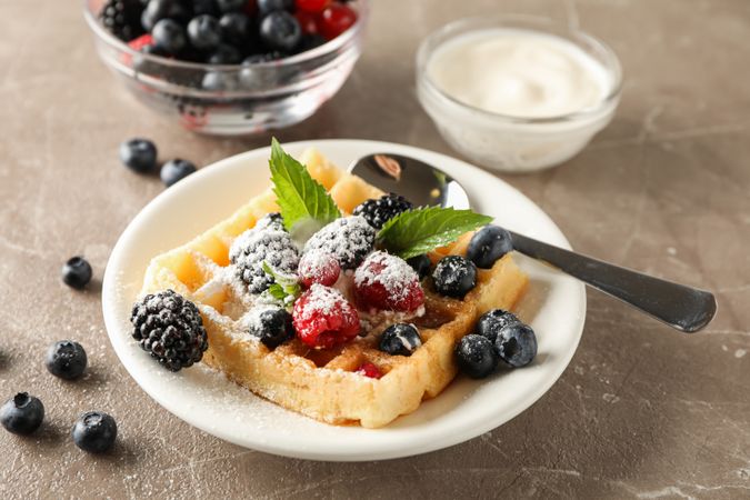 Composition of breakfast with belgian waffle, space for text