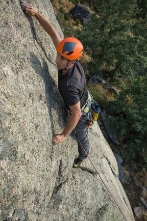 Man climbing a rock