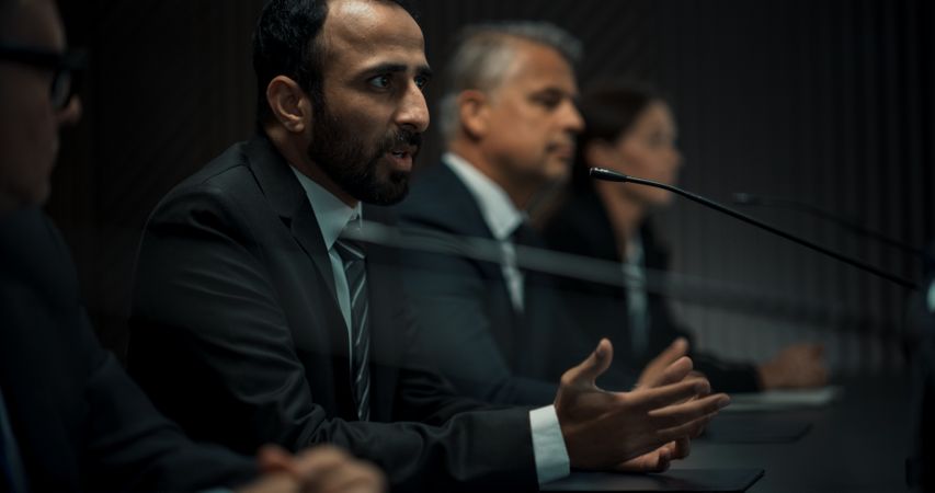 Multiethnic Male Head Of Political Delegation Speaking At International Economic Forum Press Conference.