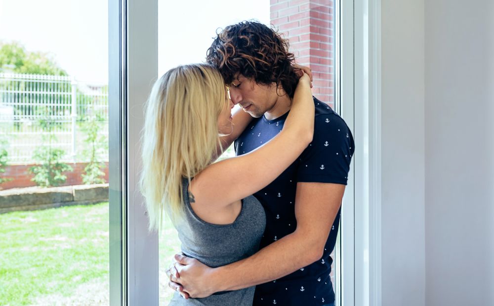 Couple hugging in the living room