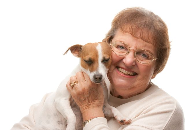 Happy Attractive Older Woman with Puppy.