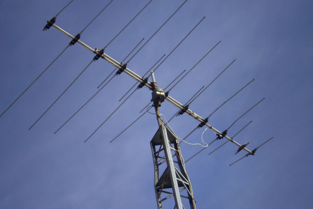 Antenna Tower Under Clear Blue Sky Used For Signal Transmission