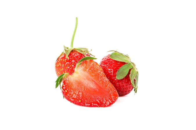 Strawberries isolated on light background. Summer sweet fruits and berries