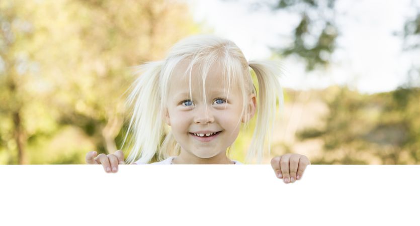 Cute Little Girl Holding White Board with Room For Text