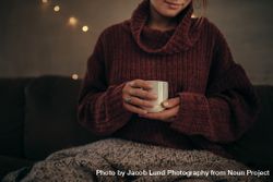 Woman having coffee in winter at home 5r93Ed