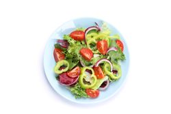 Salad of fresh vegetables isolated on blank background, top view