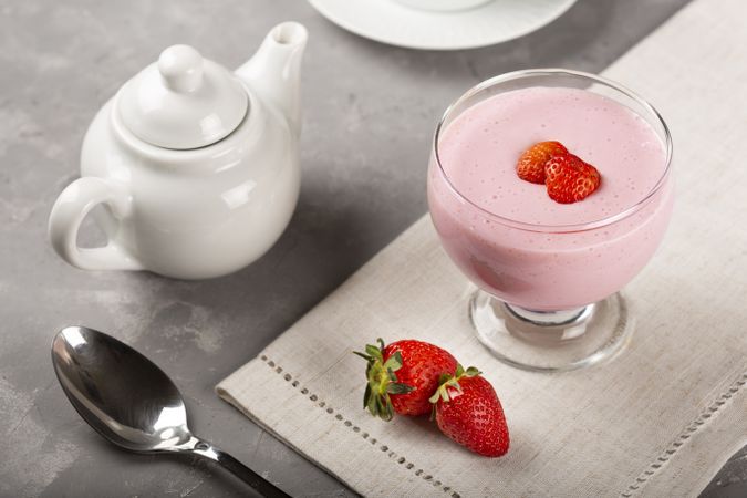 Delicious strawberry mousse in glass goblet.