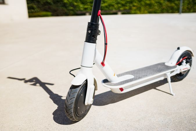 Close up of electric scooter parked in the sun