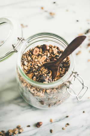 Top view glass container of homemade granola