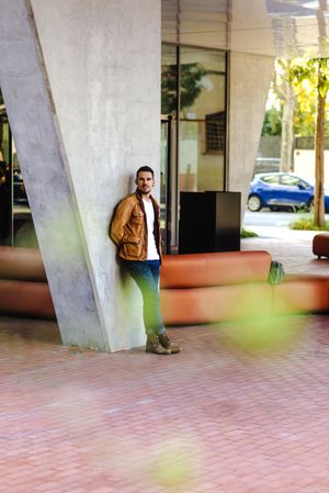 Stylish man outside modern building
