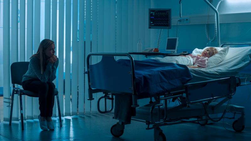 Sick Little Girl Lying in the Hospital Bed Sleeping, Her Mother Worries and Prays Beside Her.