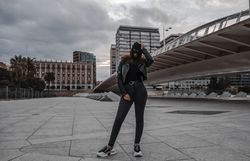 Woman in balaclava and leather jacket