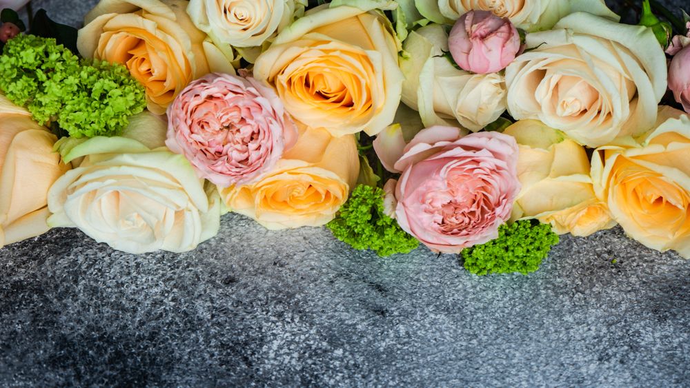 Spring flowers on grey table