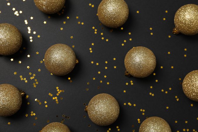 Christmas balls and glitter on dark background. Happy new year
