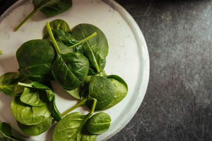 Fresh spinach on a rustic concrete crockery