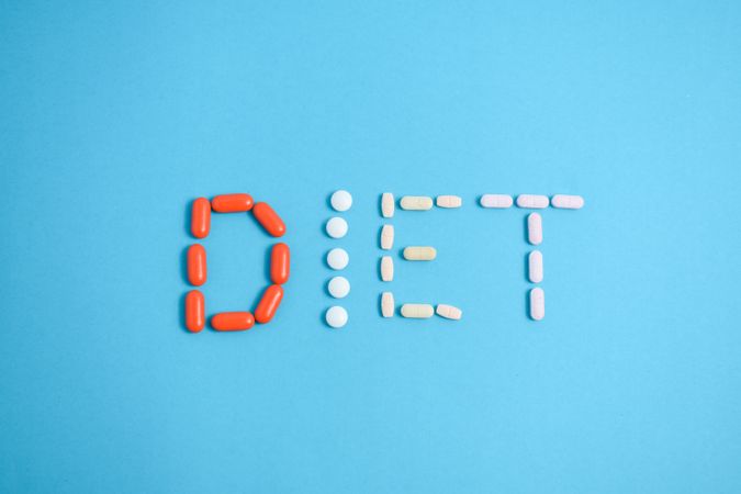 Various pills spelling the word "DIET"