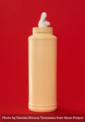 Mayo plastic bottle isolated on a red background 4MGPY1
