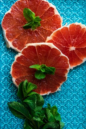 Freshly cut grapefruit slices with mint