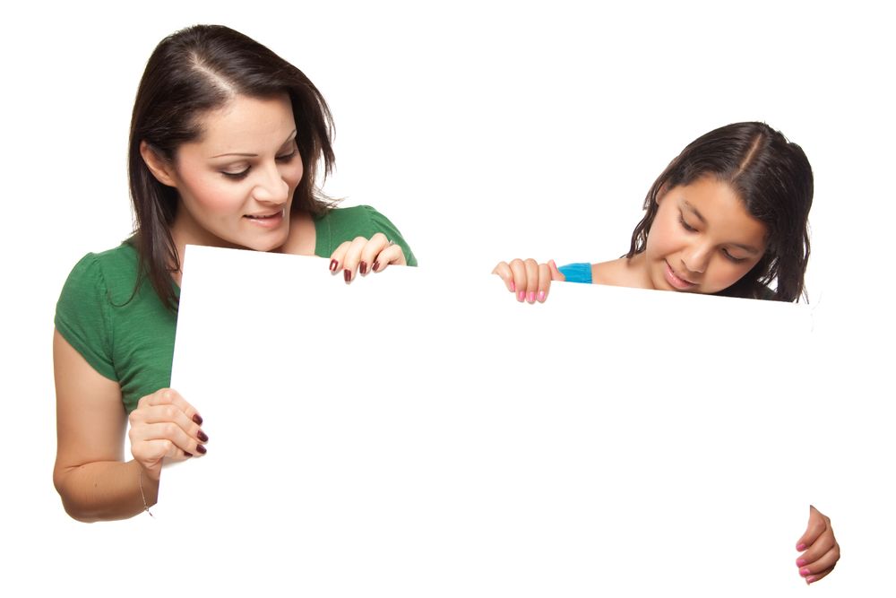 Hispanic Girl and Mother Holding Blank Board