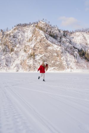 Frozen woman wrapped in scarf on winter day