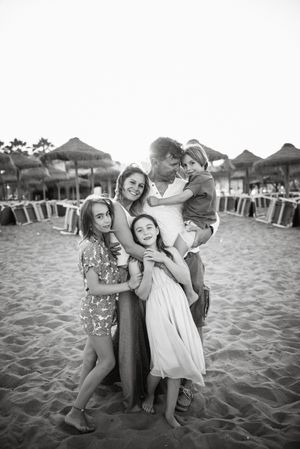 Beautiful happy family with children on beach