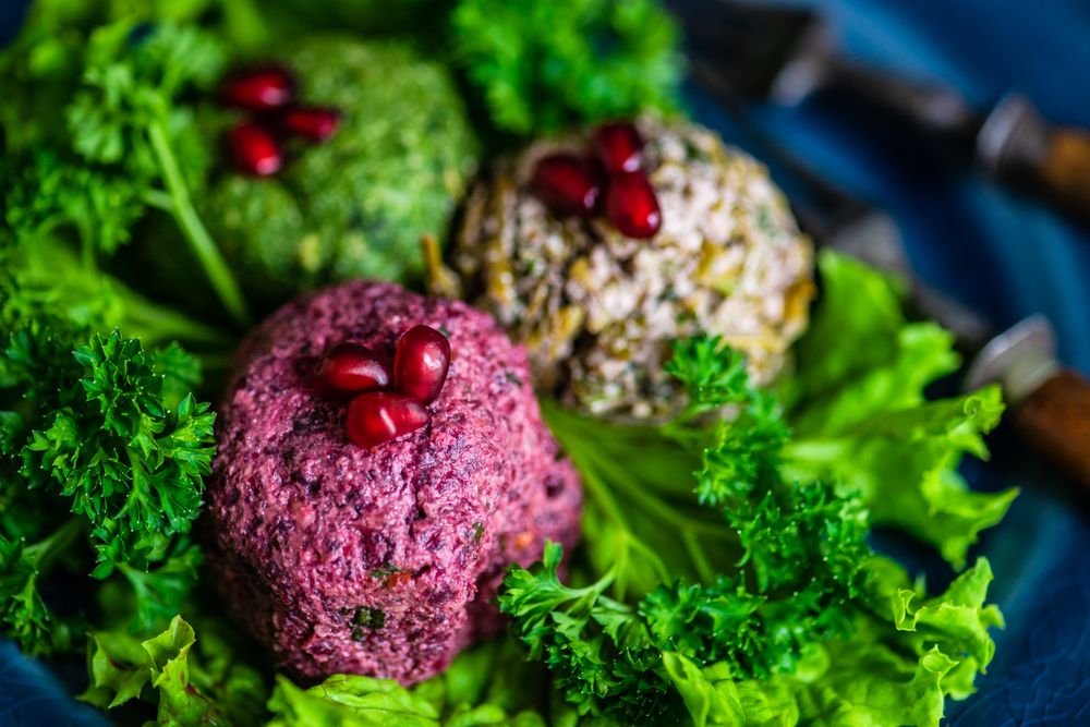 Close up of vegetable Georgian dish pkhali on a bed of lettuce
