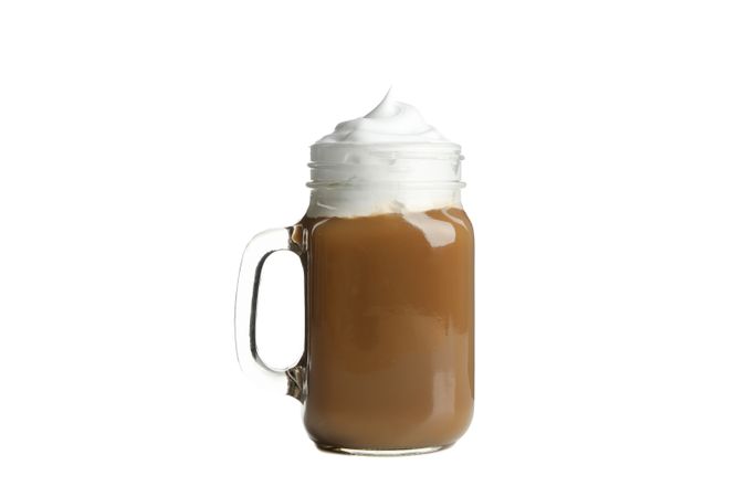 Iced coffee with poured cream isolated on plain background