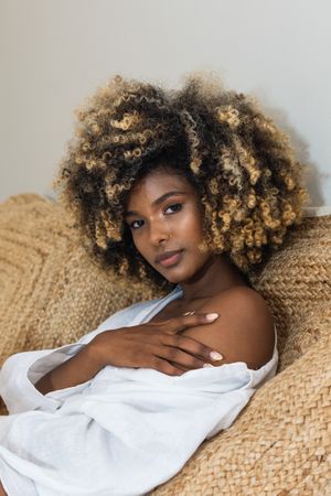 Gentle Black woman touching bare shoulder