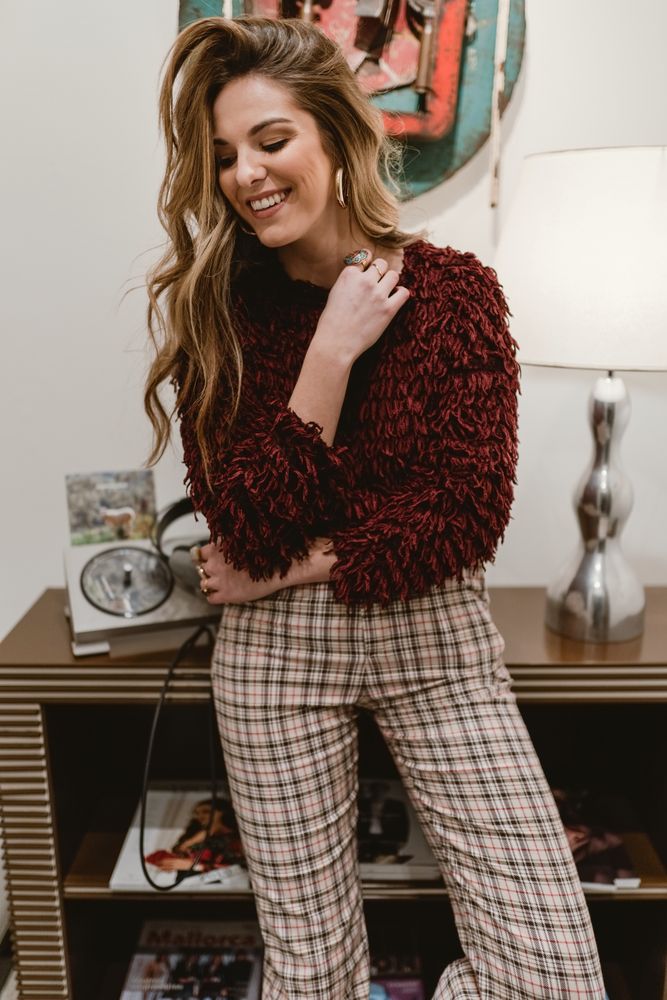 Cheerful woman in stylish room