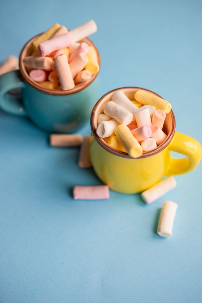 Food concept of two cups full of marshmallows