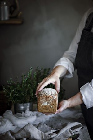 Fresh bread on napkin near tomatoes jam