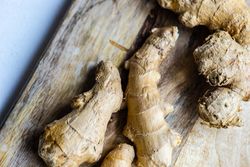 Raw ginger on wooden board