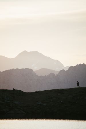 Majestic mountain landscape with human silhouette