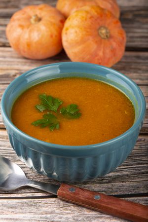 Delicious homemade pumpkin soup in bowl.