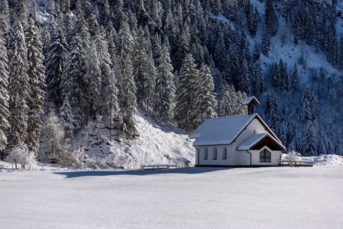 Church in a winter scenery with snow-covered nature in the Bavarian Alps, Germany