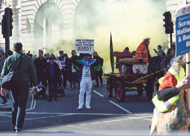 London, England, United Kingdom - March 19 2022: Smoke emerges from crowd at protest