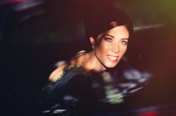 Charming bride in car looking out window