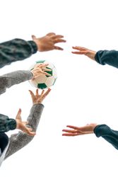 Three generations playing with soccer ball