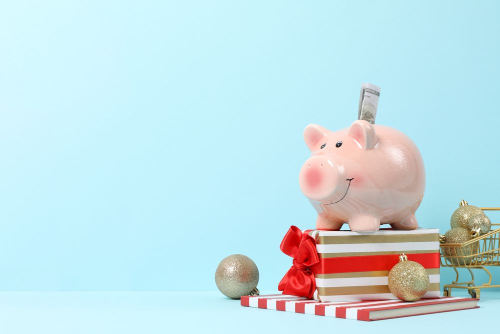 Concept of Christmas finance with piggy bank, space for text