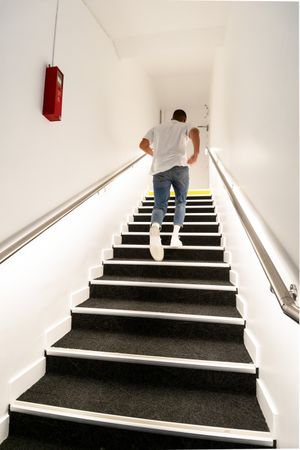 Man climbing stairs indoor