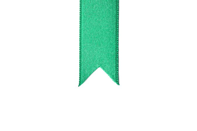 Green ribbon isolated on blank background. Gift concept