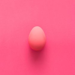 Pink egg on pink background
