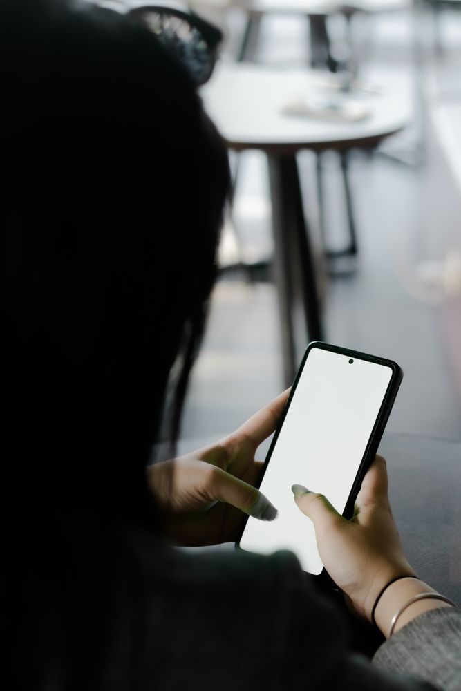 A woman interacts with her smartphone, showcasing modern communication