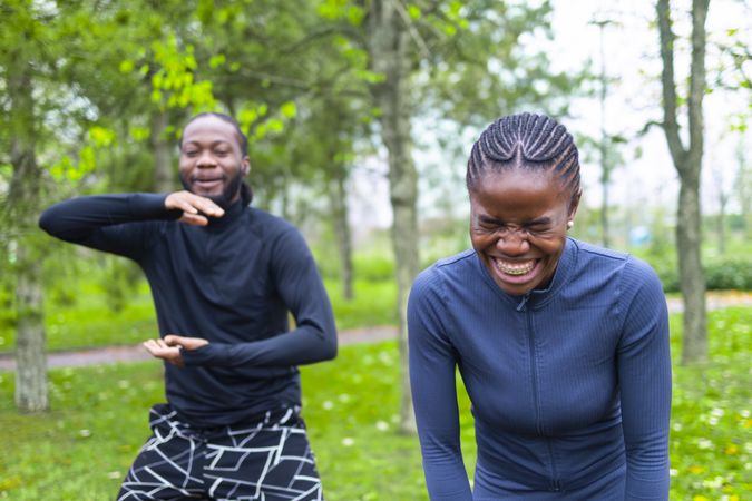Friends having a laugh during their workout.