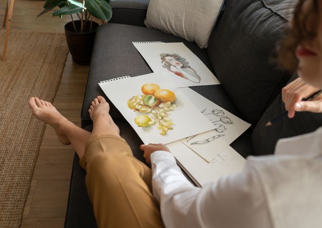 Woman with draws on papers