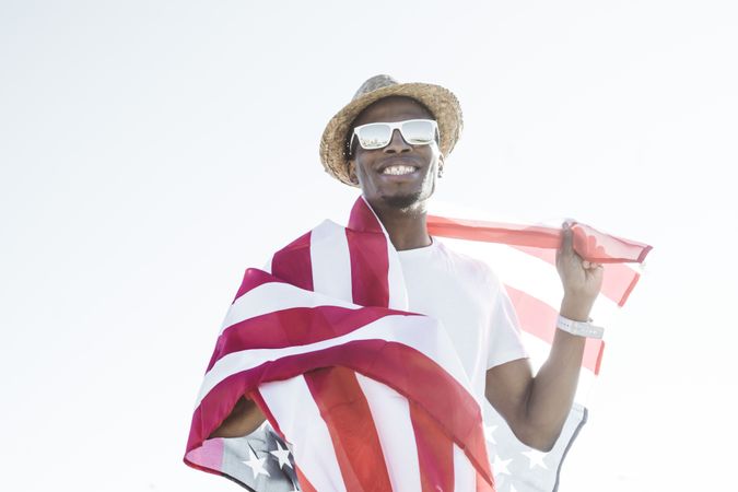 Cheerful black man with American flag