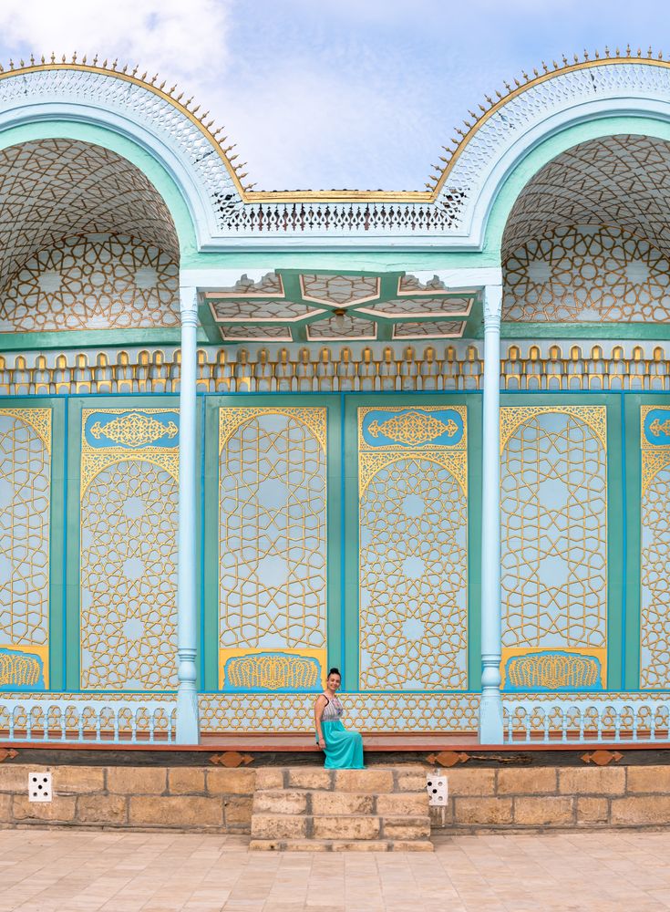 Woman leaving ornamental building