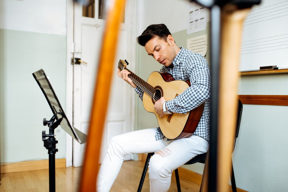 Man playing guitar in studio